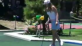 Blonde petite teen April teases with solo masturbation outdoors, fingering her pussy.