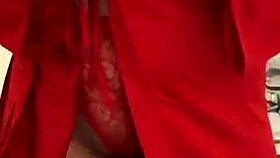 brunette in red lingerie plays with herself