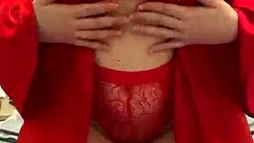 brunette in red lingerie plays with herself