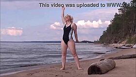 blonde beauty charges through a steamy bath at sea