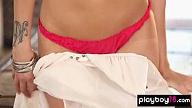 Big-boobed blonde American babe XO Gisele slips off tiny red panties, revealing shaved curves.