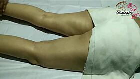 the amateur indian lady receives a full body massage close up at home with homemade techniques.