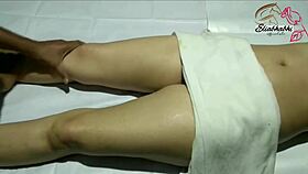 the amateur indian lady receives a full body massage close up at home with homemade techniques.