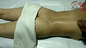 the amateur indian lady receives a full body massage close up at home with homemade techniques.