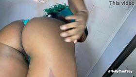 this hairy woman slips off her panties and starts masturbating her horny pussy all alone