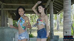 Small Asian and Russian lesbian teens pose outdoors in sexy display