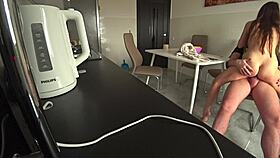 Wife sneaks a steamy fuck with neighbor in kitchen while husband works. Cheating to settle debts feels so wrong.