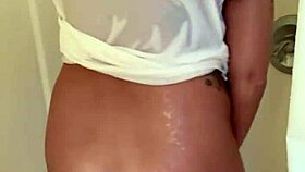 Milf fulfills fan request in the shower with dildo