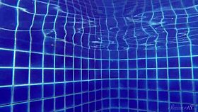 blonde babe wendy strips and swims nude in the pool