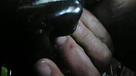 A person explores fisting with a large toy fist in a private session