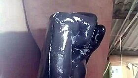 A person explores fisting with a large toy fist in a private session