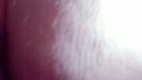 A person explores fisting with a large toy fist in a private session