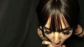 Petite babe in fishnet poses playfully against the wall