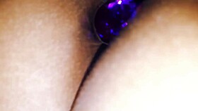Playing with my sister's ass, she has a purple plug inside her big latina ass for anal sex 😏.