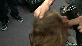 Watch the slave get fucked in the wall stockade in public.