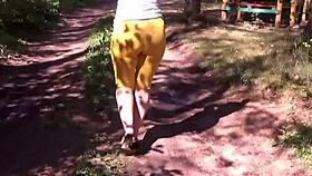 mature milf flashes her big ass outdoors feeling horny.