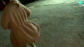 Watch this mature street whore shoving items into her shaved pussy on the run