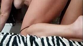 tanned brunette shows off her tattooed ass bent over