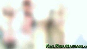 Blonde milf masseuse in nuru gets licked by babe