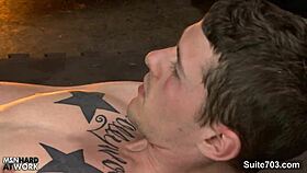 Gay mechanics engage in activities in the garage