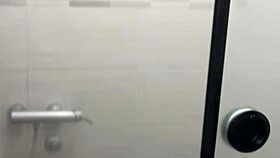 She undresses and shaves in the shower, touching herself while fantasizing about being watched closely