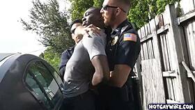 in the office, two police officers take advantage of the black guy