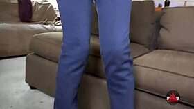 A black submissive model is asked to show her ass wearing jeans