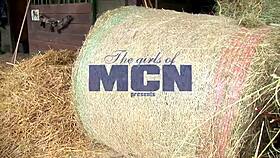 megan cox relaxes outdoors, fingering her pussy in the hay