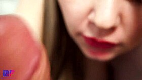 This babe with red lips gives an amazing close-up blowjob, contrasting her big tits and tongue skills.