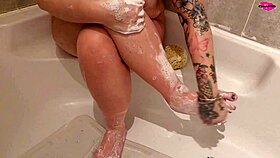 Milf seductively washing her feet