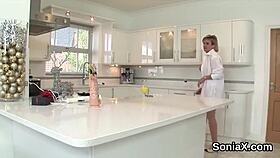 British mature Gill Ellis flaunts her enormous melons in wedding lingerie. She teases the camera seductively.