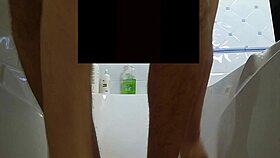 A young gay man takes a shower with an erection and washes his genitals