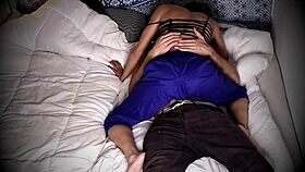 Hidden cam captures a gay couple having passionate sex in bed.