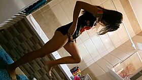 voyeur catches pretty babe showering in bathroom with close-up natural tits view. her wet body glistens under water.