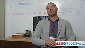 Blindfolded gay hunk grabs ass in wild office swing party.