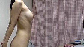 Undressing babe casually reveals her nice tits on webcam for fun