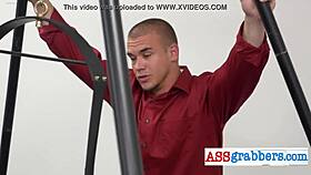 Blindfolded gay hunk grabs ass in wild office swing party.