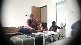 In the hotel, he flashes his cock to two maids during a massage session