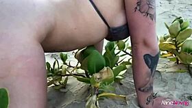 Blonde girl on the beach banging her fan hard