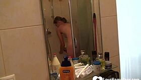 Blonde beauty in shower masturbates intensely and quietly reaches climax