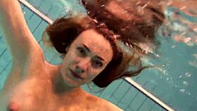 Firm big tits in red dress underwater, hinting at more with Duna Bultihalo