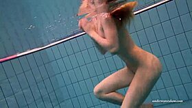 Firm big tits in red dress underwater, hinting at more with Duna Bultihalo