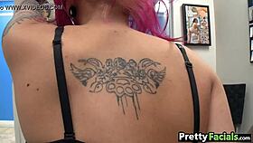 Pink-haired girl receives a tempting facial cumshot