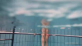 Firm big tits in red dress underwater, hinting at more with Duna Bultihalo