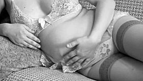 Pregnant MILF and mature girlfriend share amateur lesbian foreplay in black and white