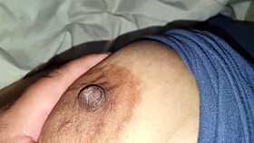 BBW squeezes her big nipples hard.