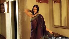 a bollywood actress UNDRESSING and DANCING in a striptease, clothes RIPPED