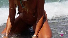 nippleringlover shows off extreme stretched nipple piercings and multiple pussy rings at nude beach