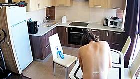 Big tits beauty with pierced nipples cleans kitchen topless for fun.