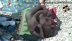 Beach voyeur catches mature couple banging under bright sun